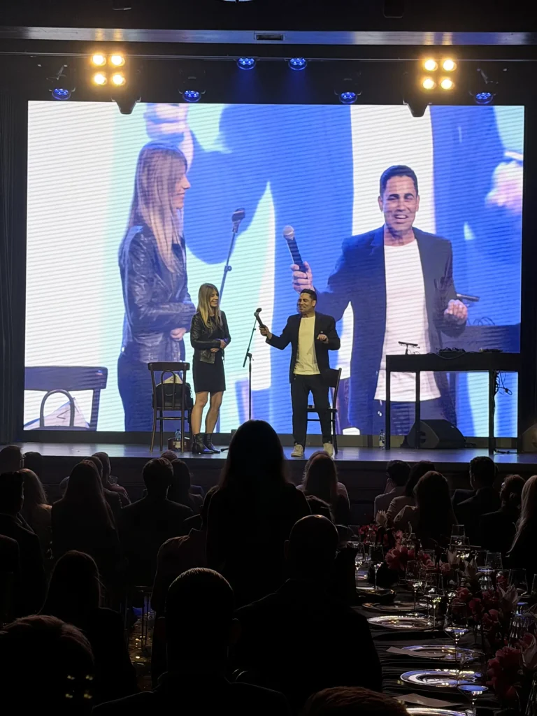 Marom Mor involving guests on a corporate stage
