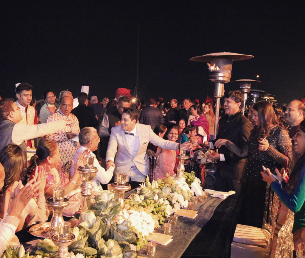 Marom Mor performing among guests at a VIP wedding in India