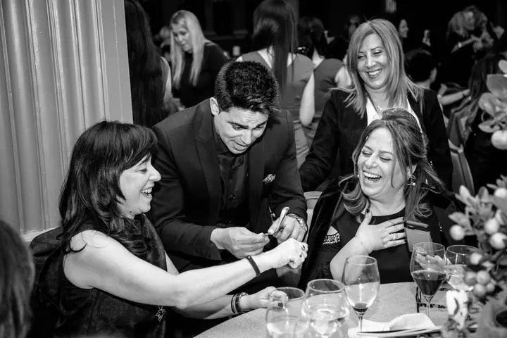 Close-up mentalism with guests at a private dinner